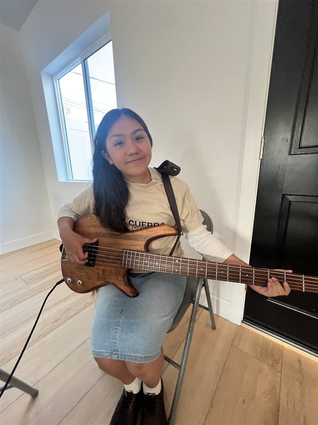 Student with her bass at Cuerda Academy